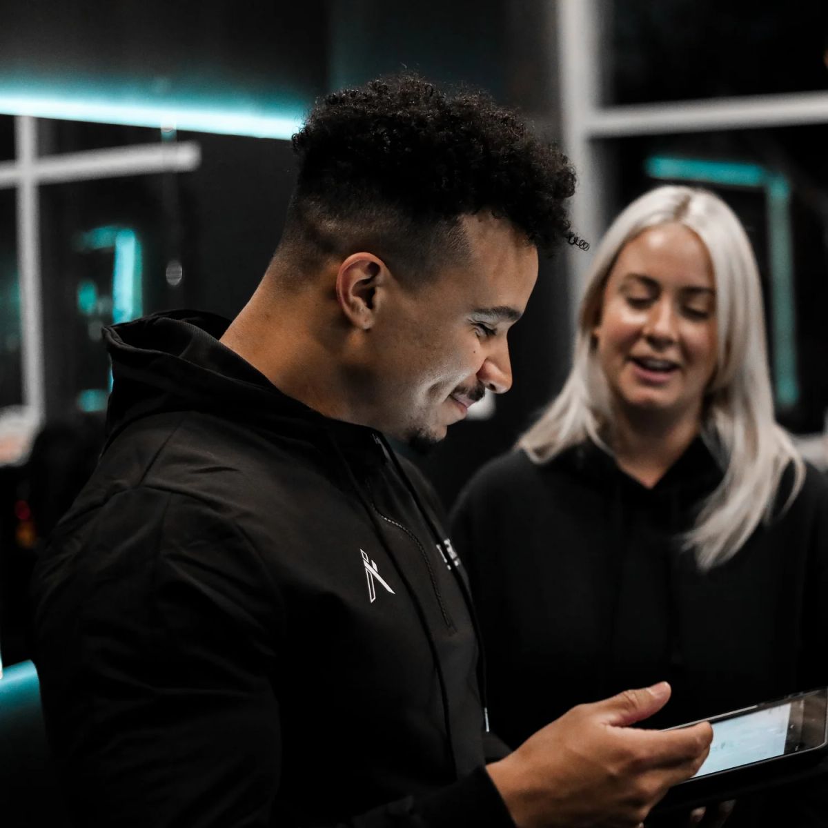 An Inertia coach reviewing the training app with a client