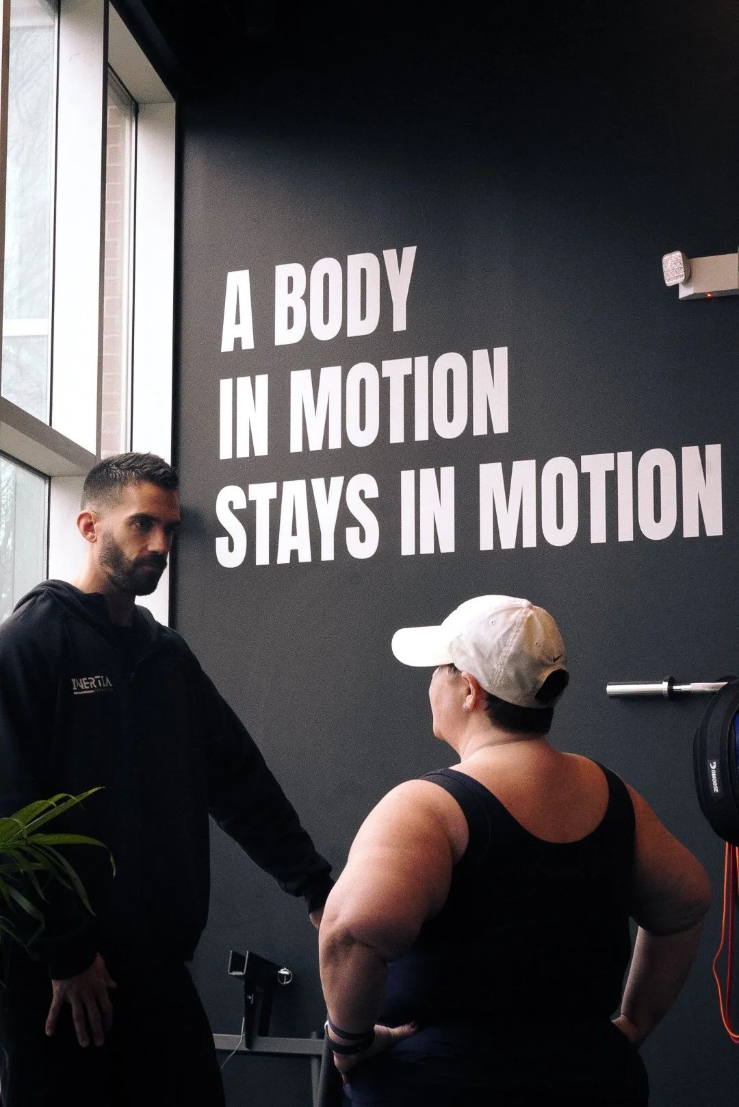 A body in motion stays in motion wall at Inertia North Charlotte